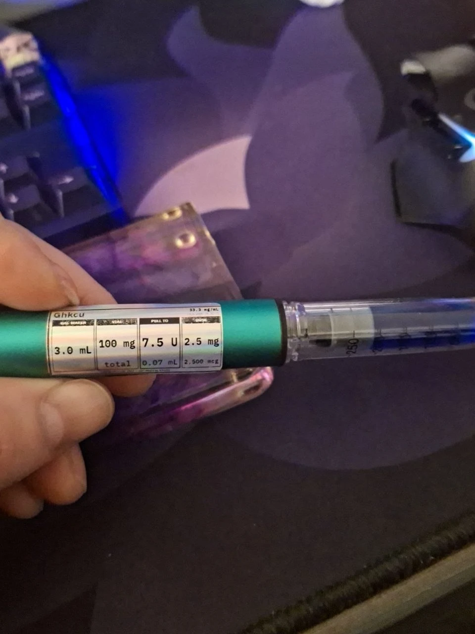 The same label printed on a Niimbot M2 and wrapped around a pen